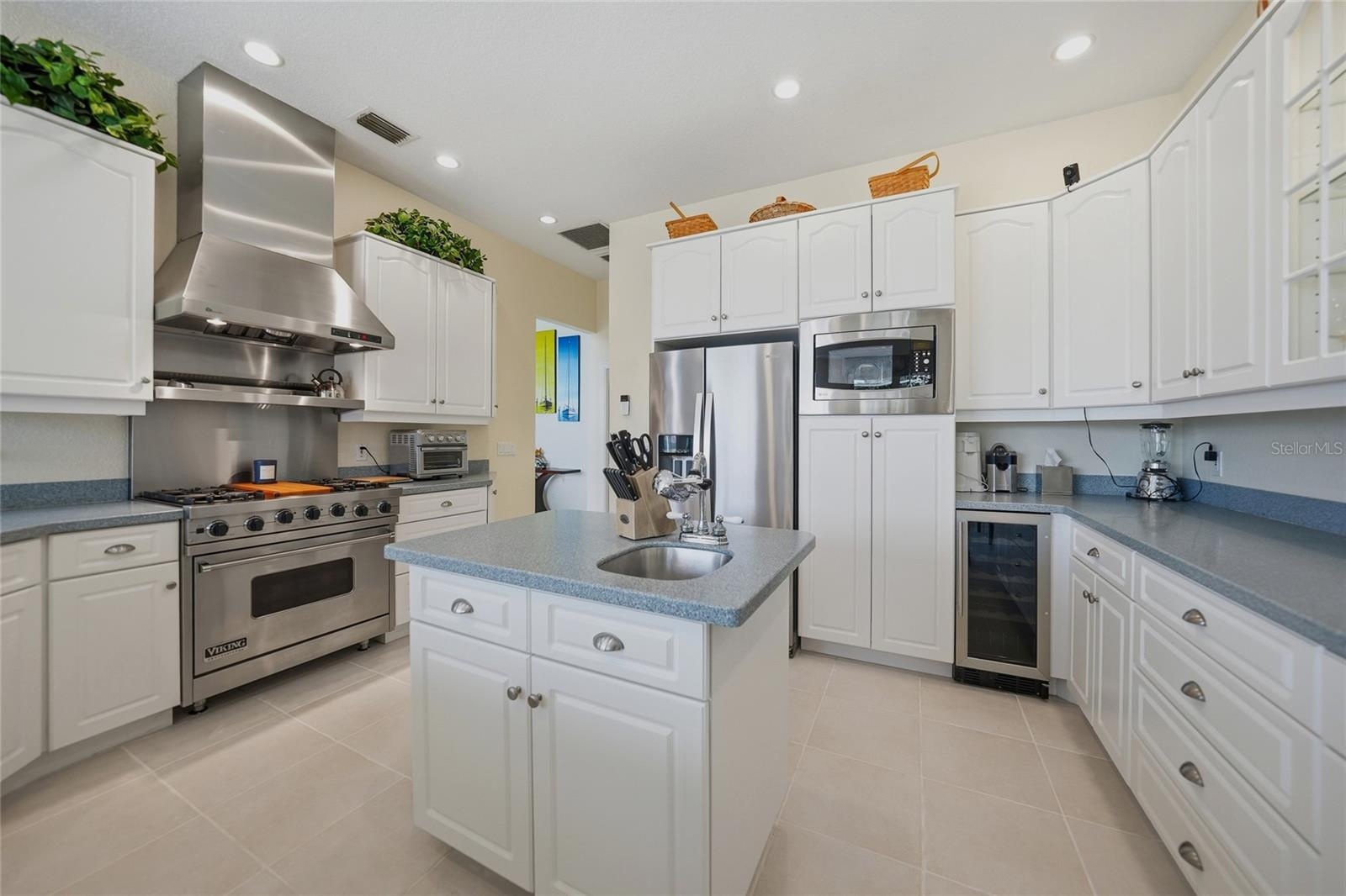 Kitchen with Gas Viking Stove and Vent Hood