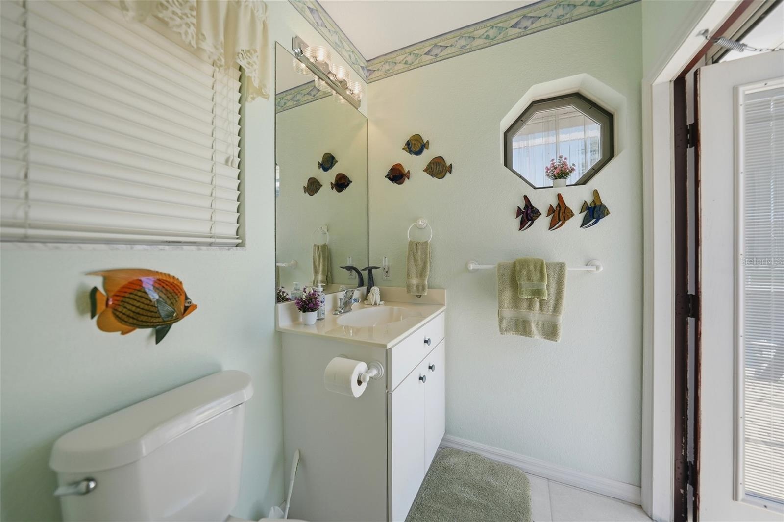 Pool Access through half bath inside Guest Bedroom 2