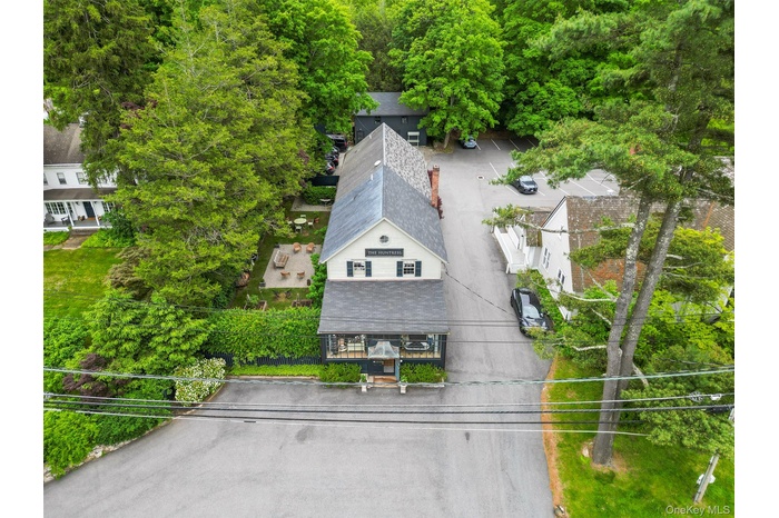 Aerial view of property and surrounding area. Apartment on second floor