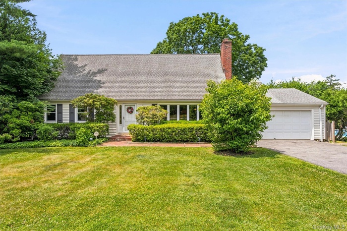 4 bedroom, 2.5 bath Cape on .49 acre private corner-lot