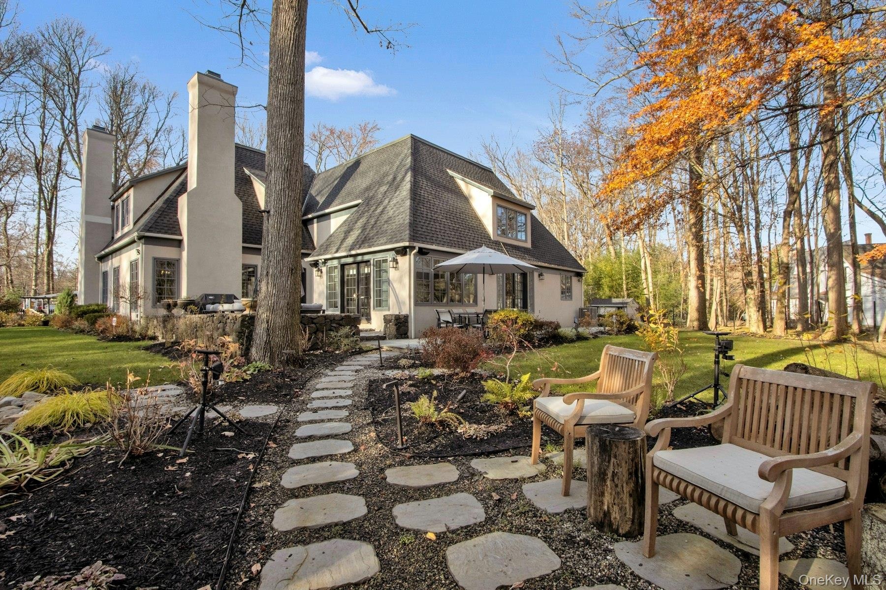 Back of property with a yard