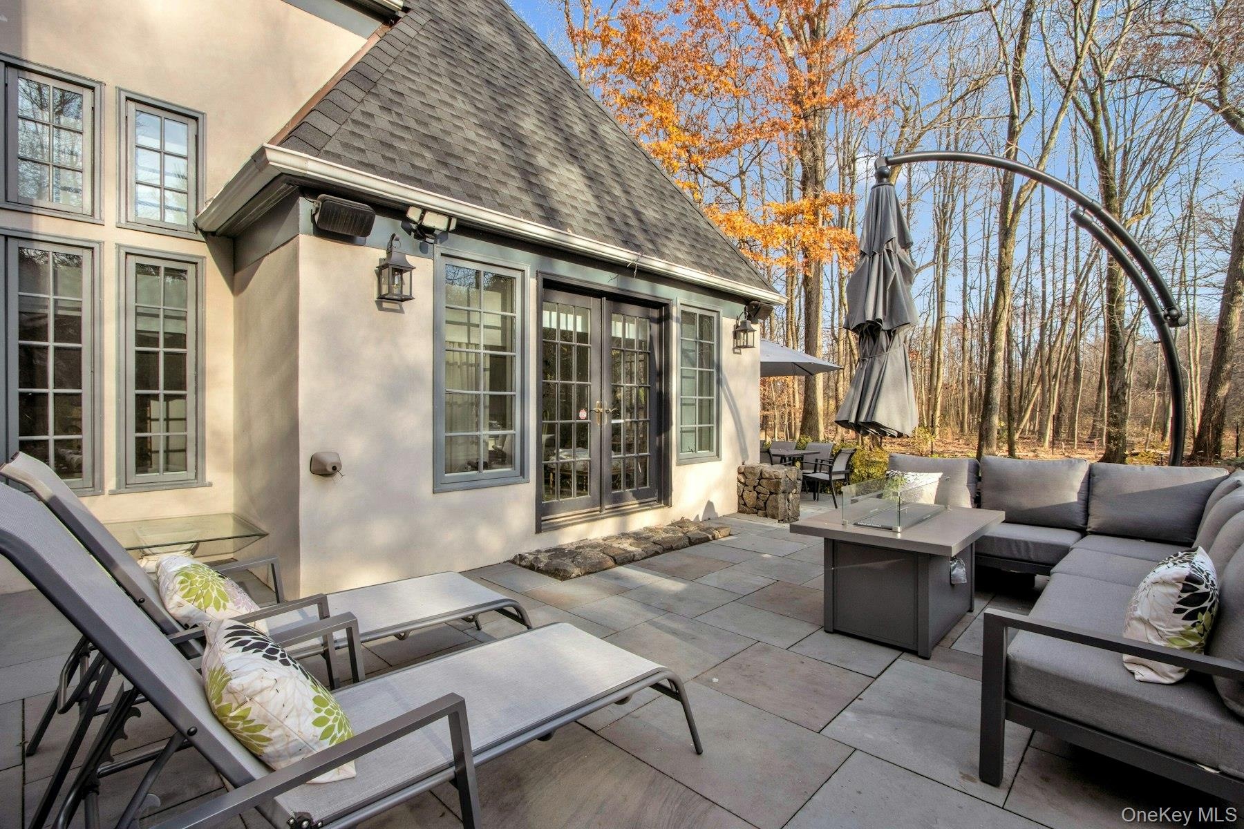View of patio / terrace with an outdoor living space with a fire pit