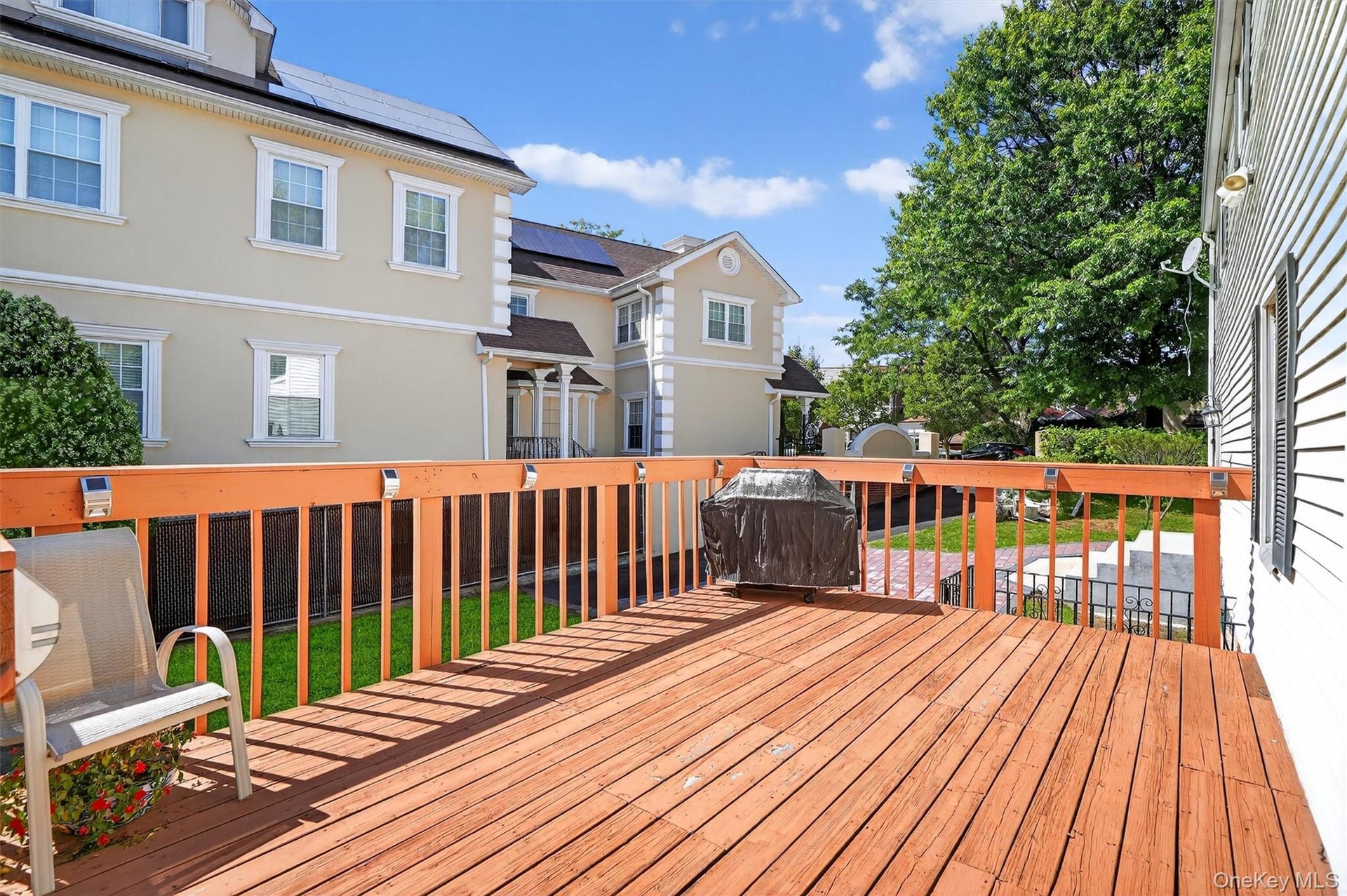 Wooden terrace with a yard