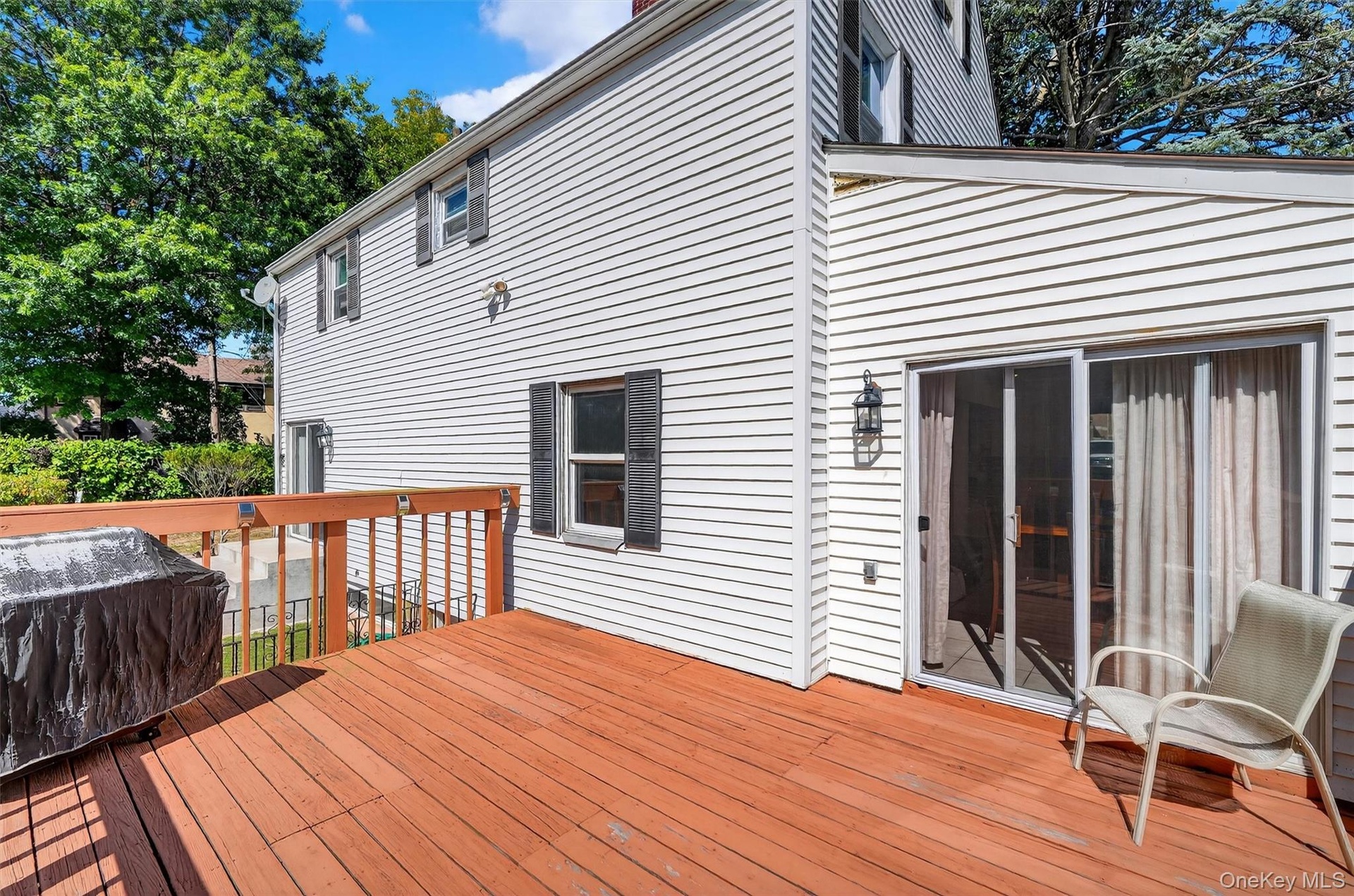 Wooden deck featuring grilling area