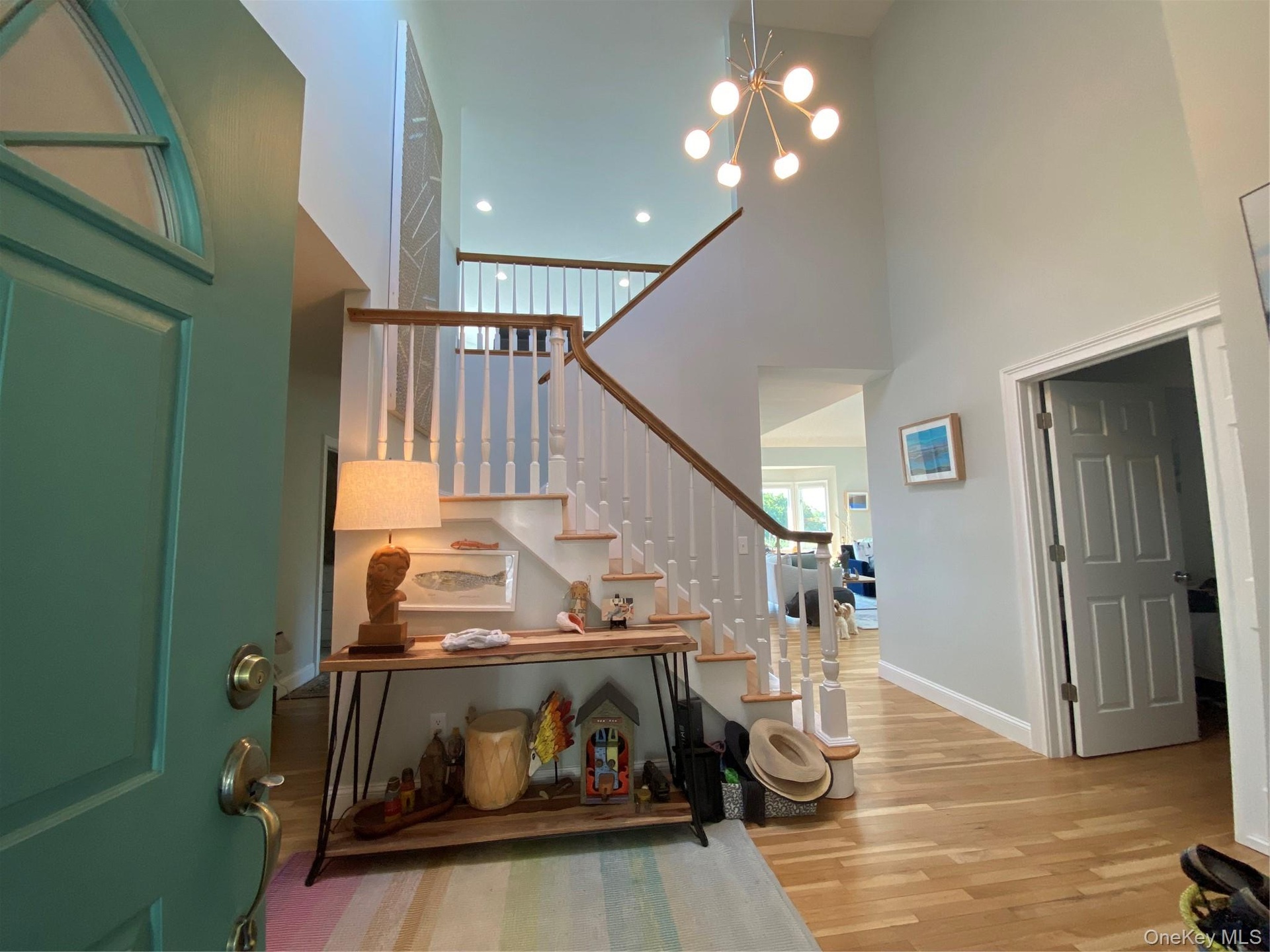Entrance foyer featuring stairway leading to a spacious loft.