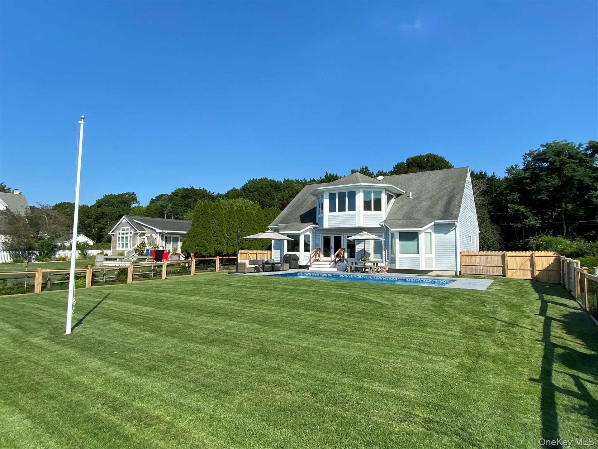Nicely manicured yard for a game of croquet!