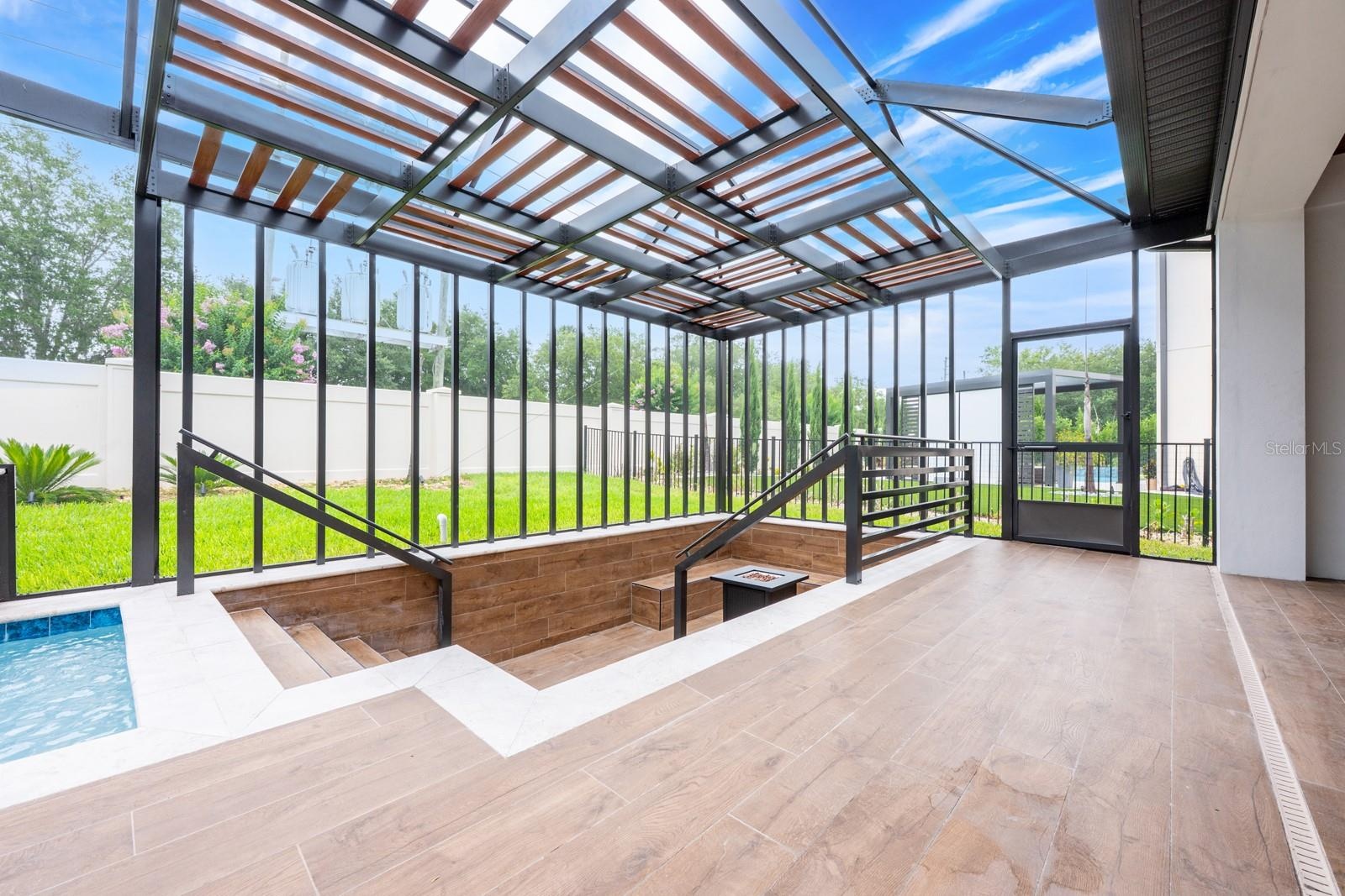 Covered lanai overlooks a private screened pool.