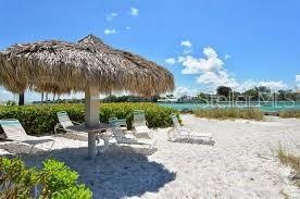 Private Beach w/ tiki's and lounge chairs