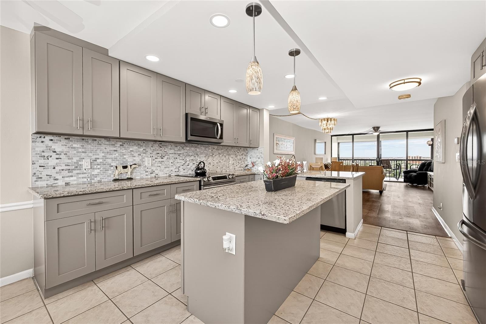Updated kitchen with gorgeous water views in both the front and back