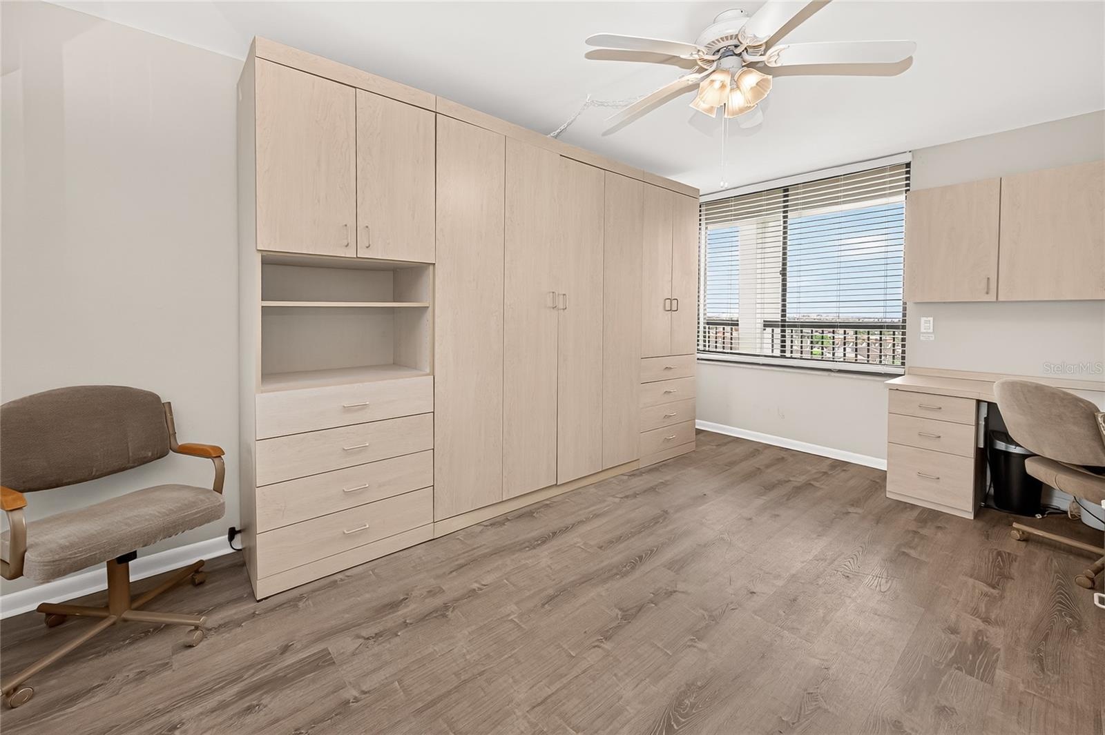 This spacious bedroom has a queen size Murphy Bed - It stays!