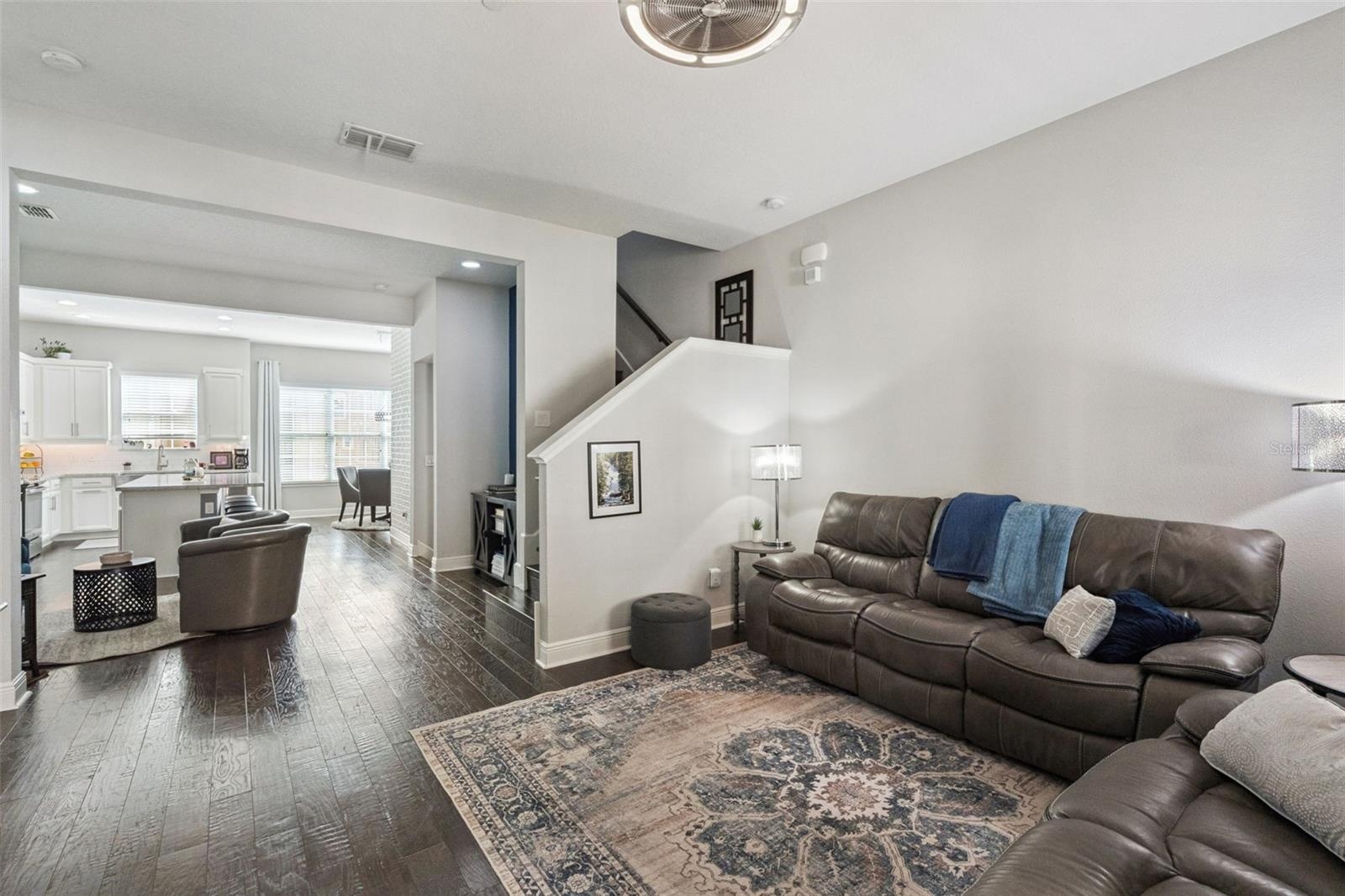 Living room to open concept kitchen and dining