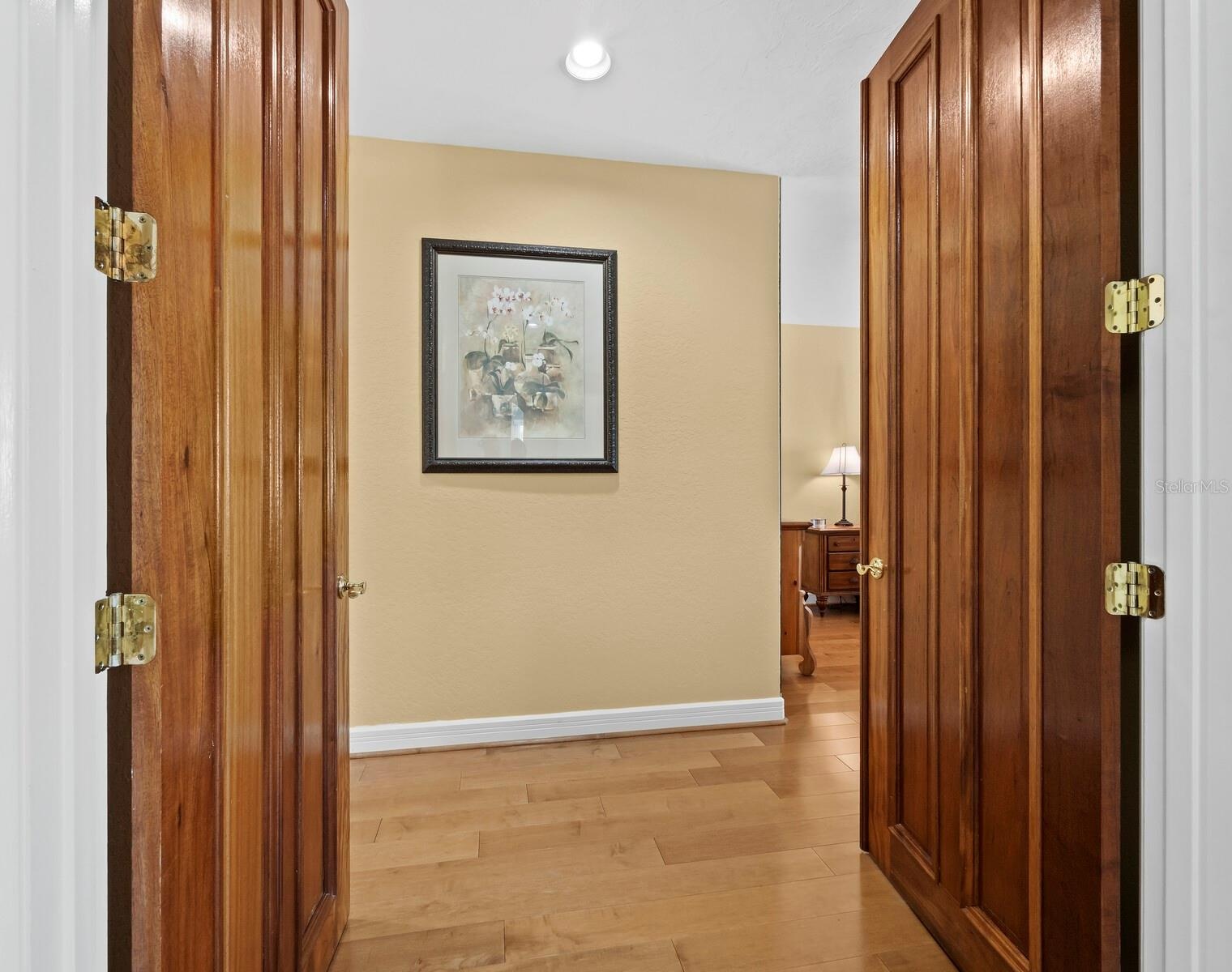 The double door entrance into the primary besdroom