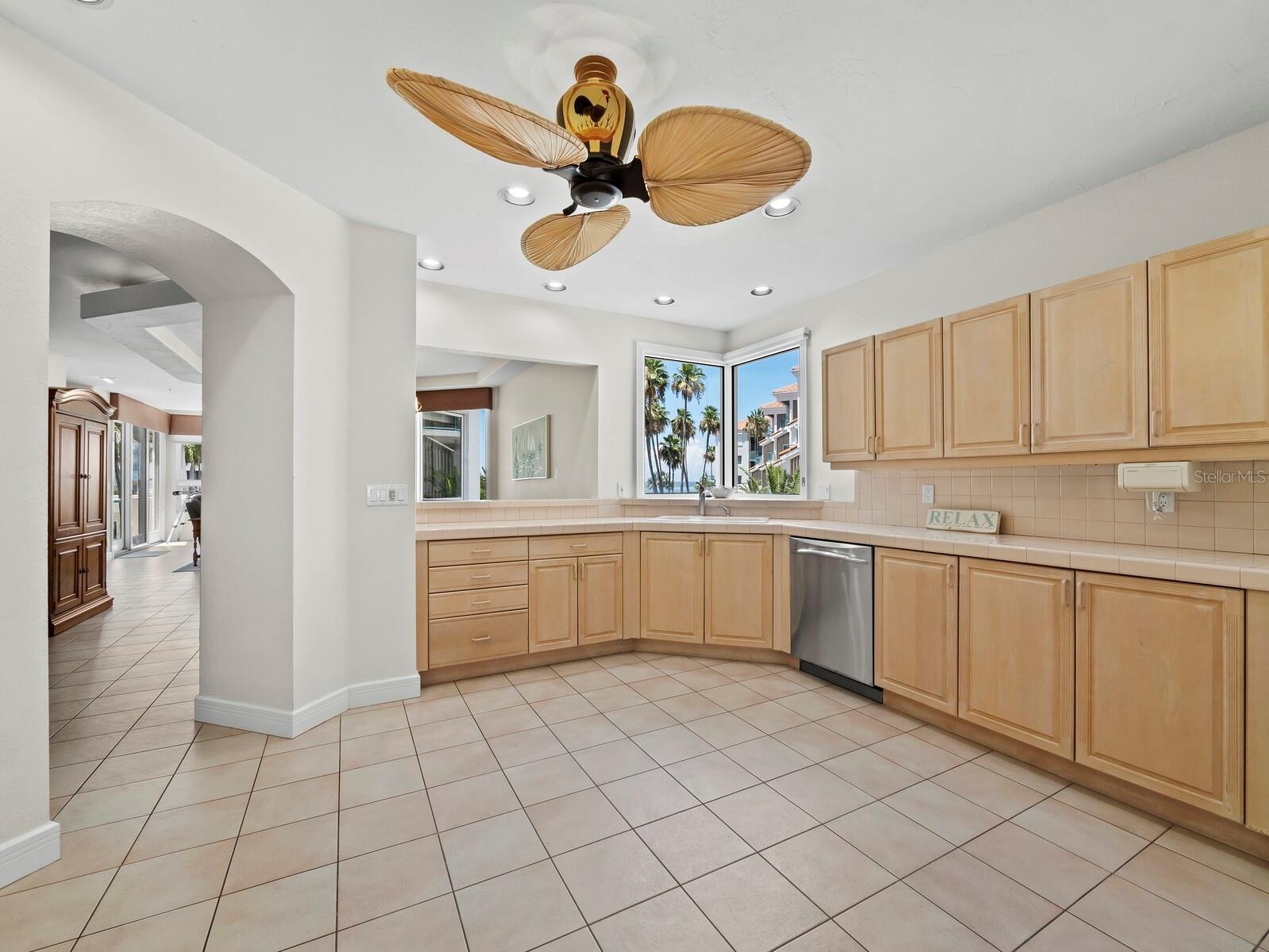 The large open kitchen has a view to the Bay through the kitchen window.