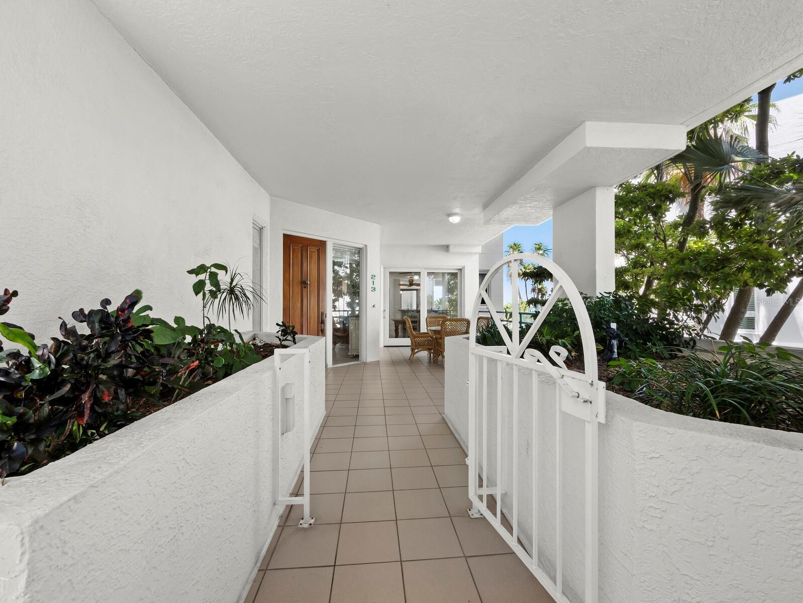 Come on in to your private courtyard, an enticing entrance and a perfect spot for your grill outside the kitchen sliders.