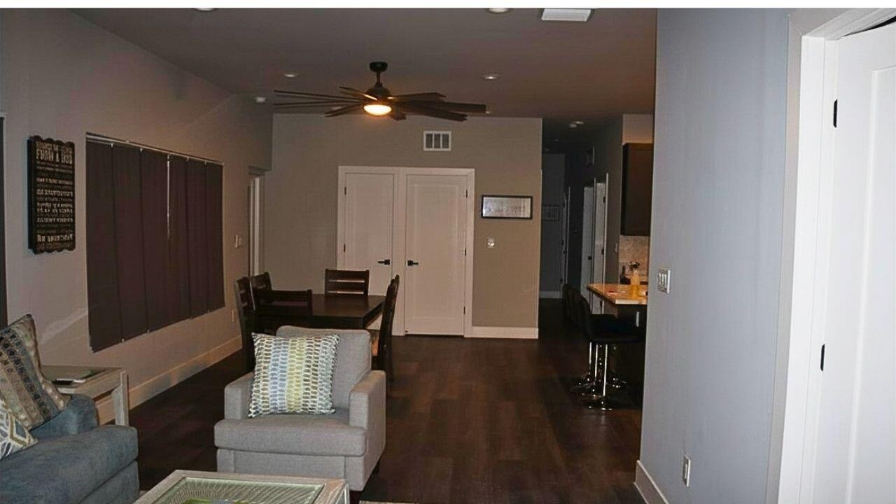 ENTRY TO LIVING ROOM FROM GARAGEConvenient access from the garage opens directly into the spacious living area, offering a seamless transition for da