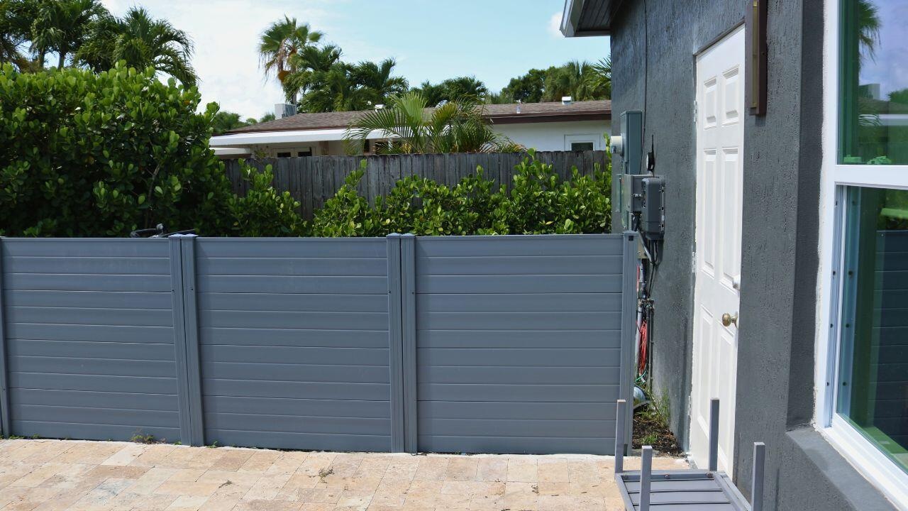 POOL EQUIPMENT AREAPool equipment is thoughtfully positioned behind a fenced enclosure, maintaining a clean and attractive backyard appearance. Wilto