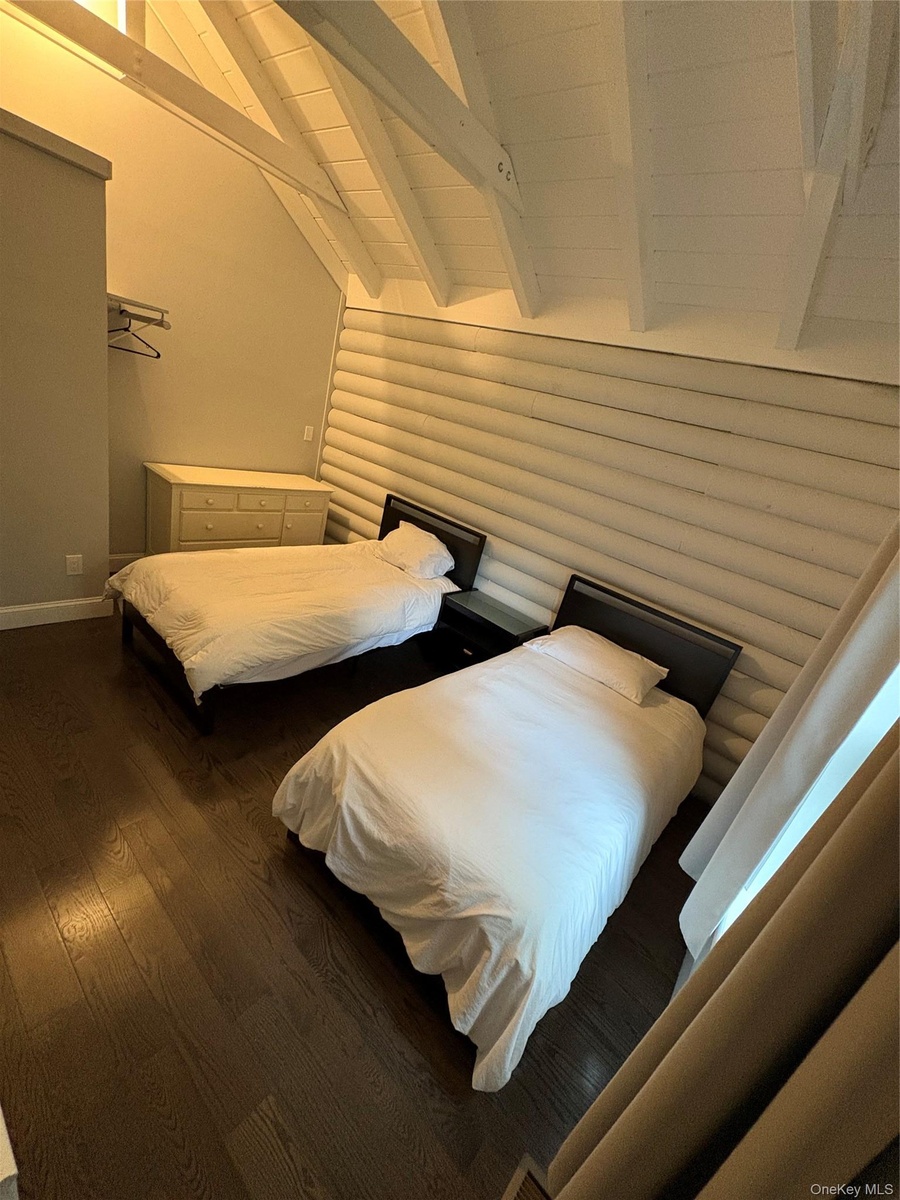 Bedroom featuring dark wood-style flooring