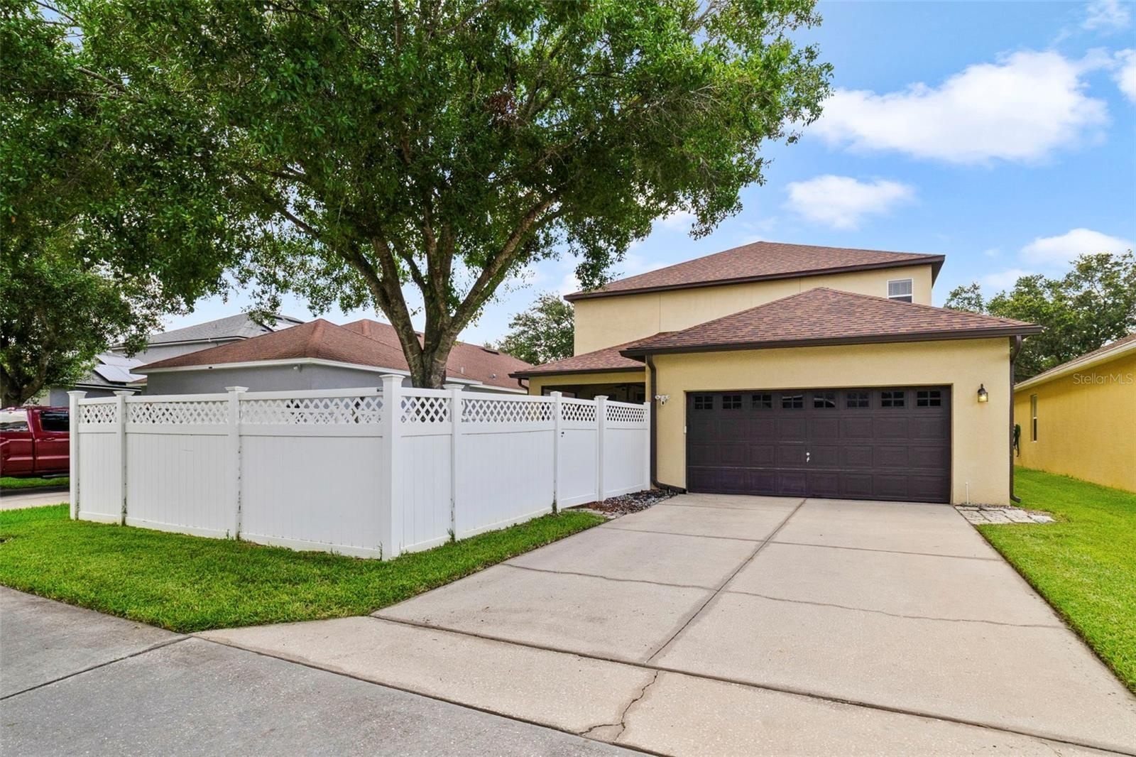 Outside, enjoy excellent CURB APPEAL, an attractive vinyl privacy fence and a rear-entry 2-CAR GARAGE with alley access, oversized workbench, and dire