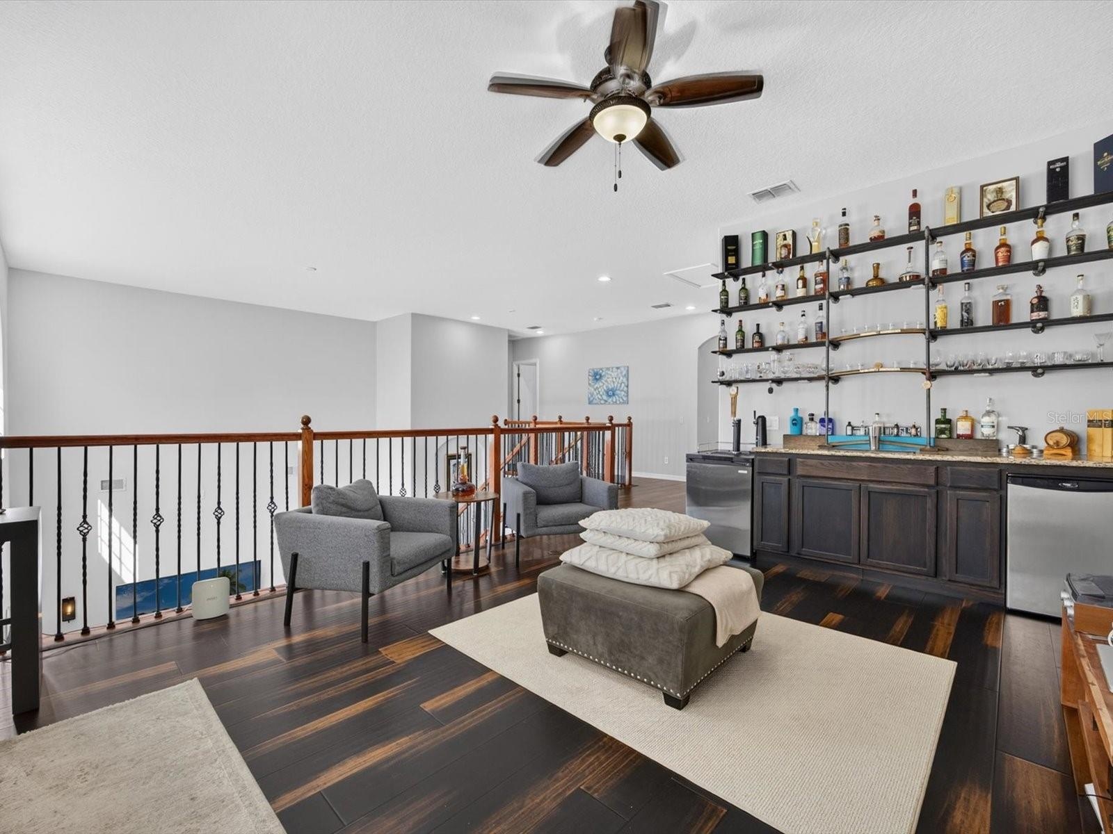 Loft with bamboo flooring and Upstairs wet bar