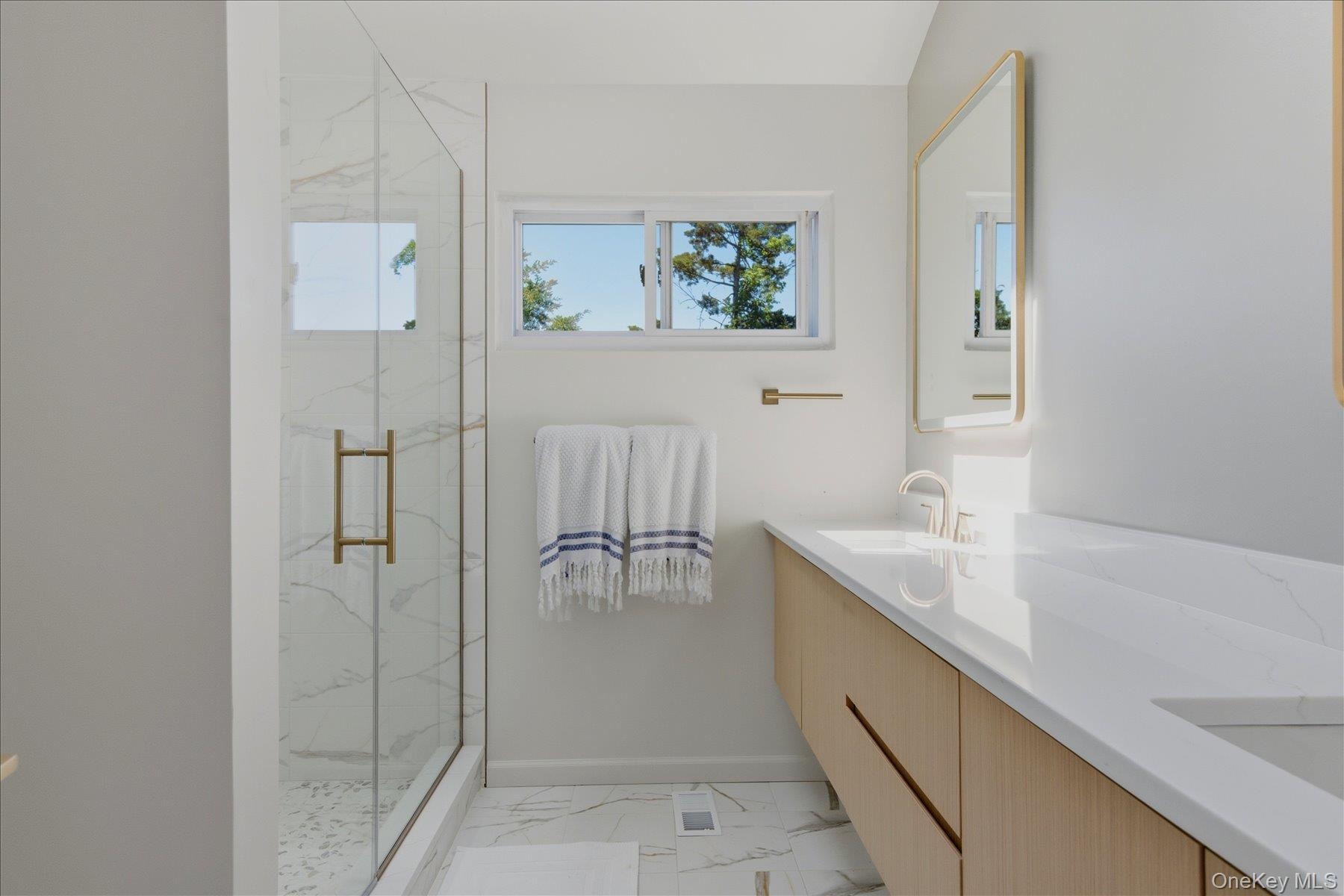 Second floor guest bathroom.  Double vanity