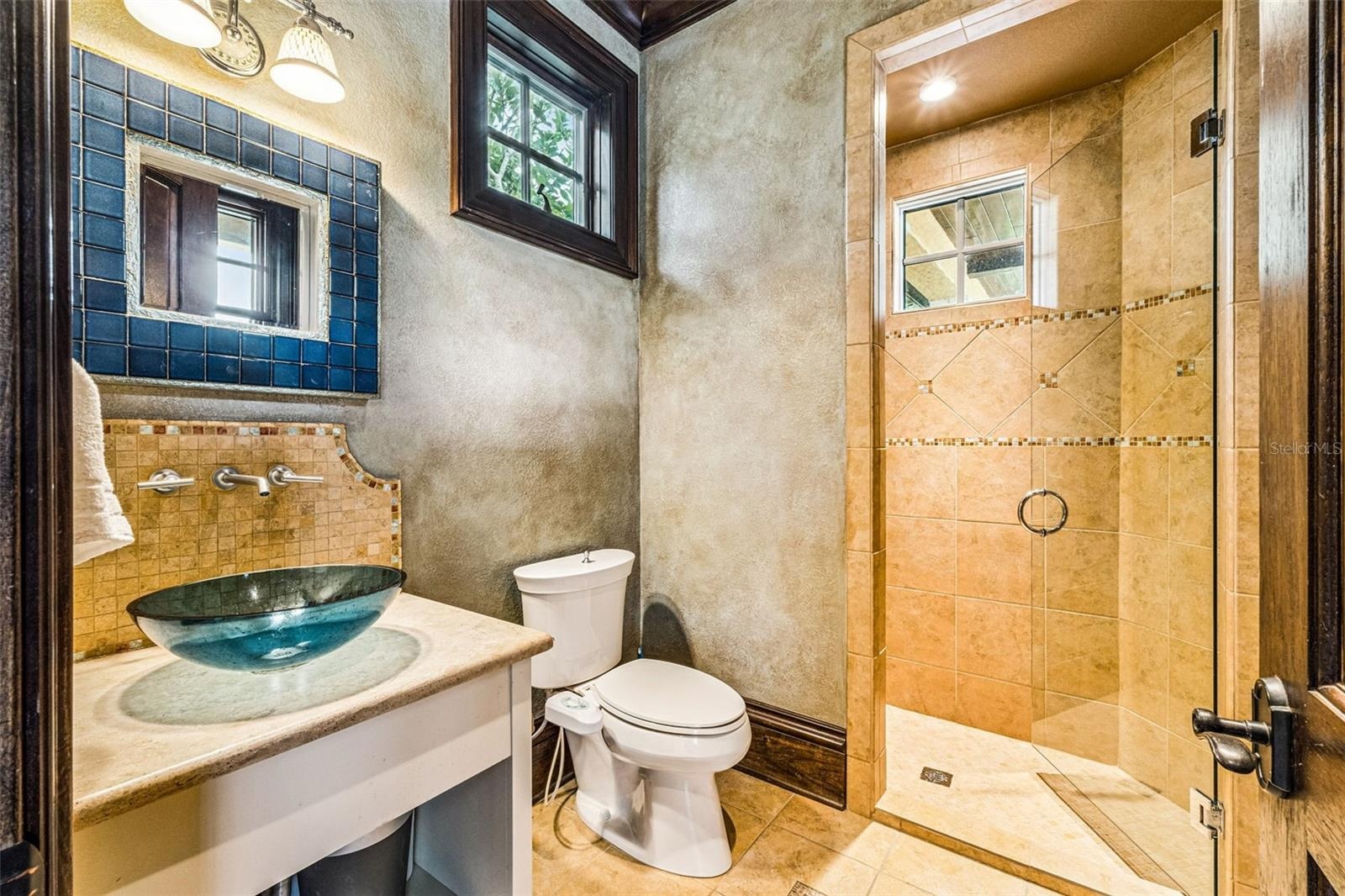 Bathroom with easy access to pool area.