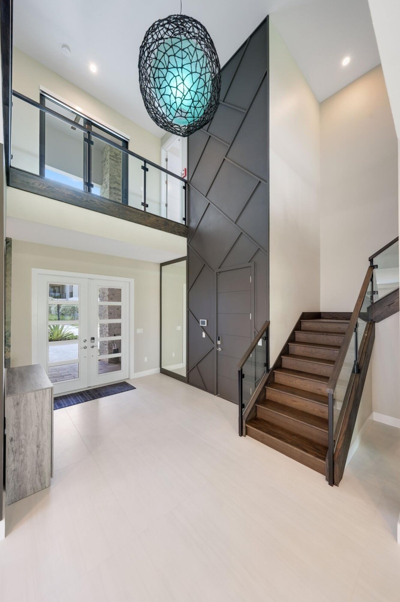 Beautiful custom wood designed stairway w custom glass panels