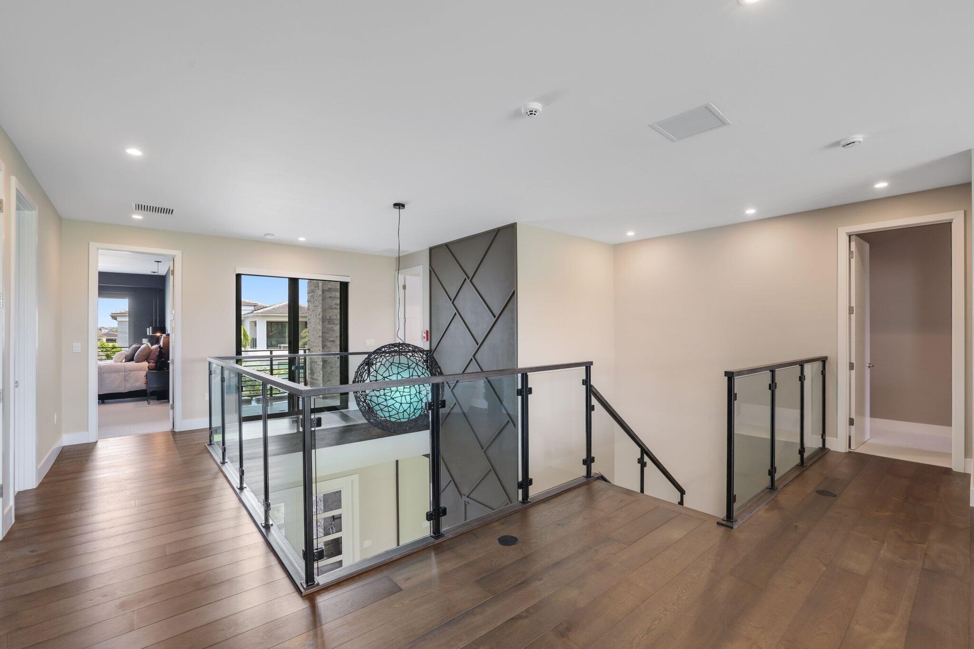 Glass rails on stairs and around the loft