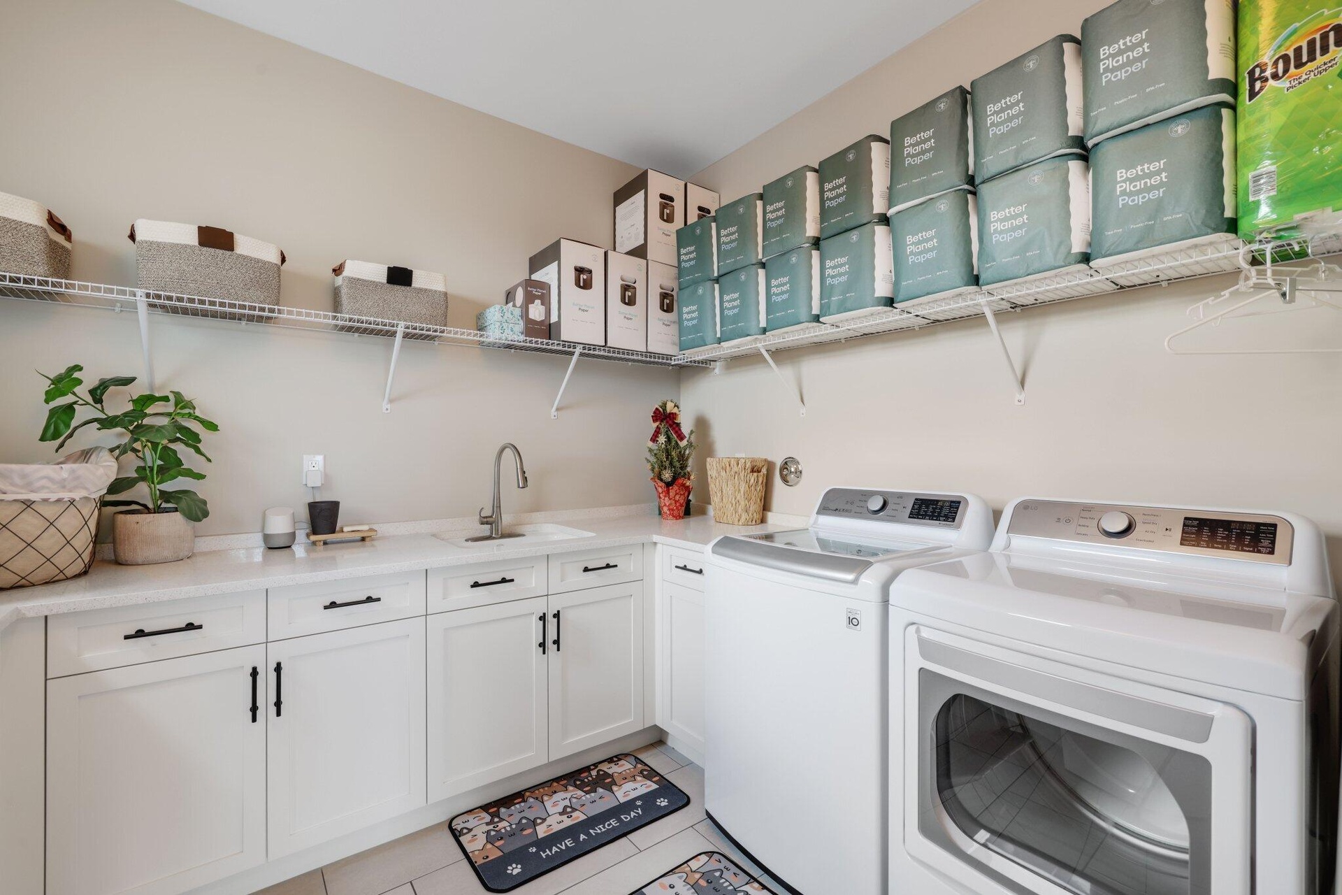Laundry Room w so much storage. Cabinetry and shelves