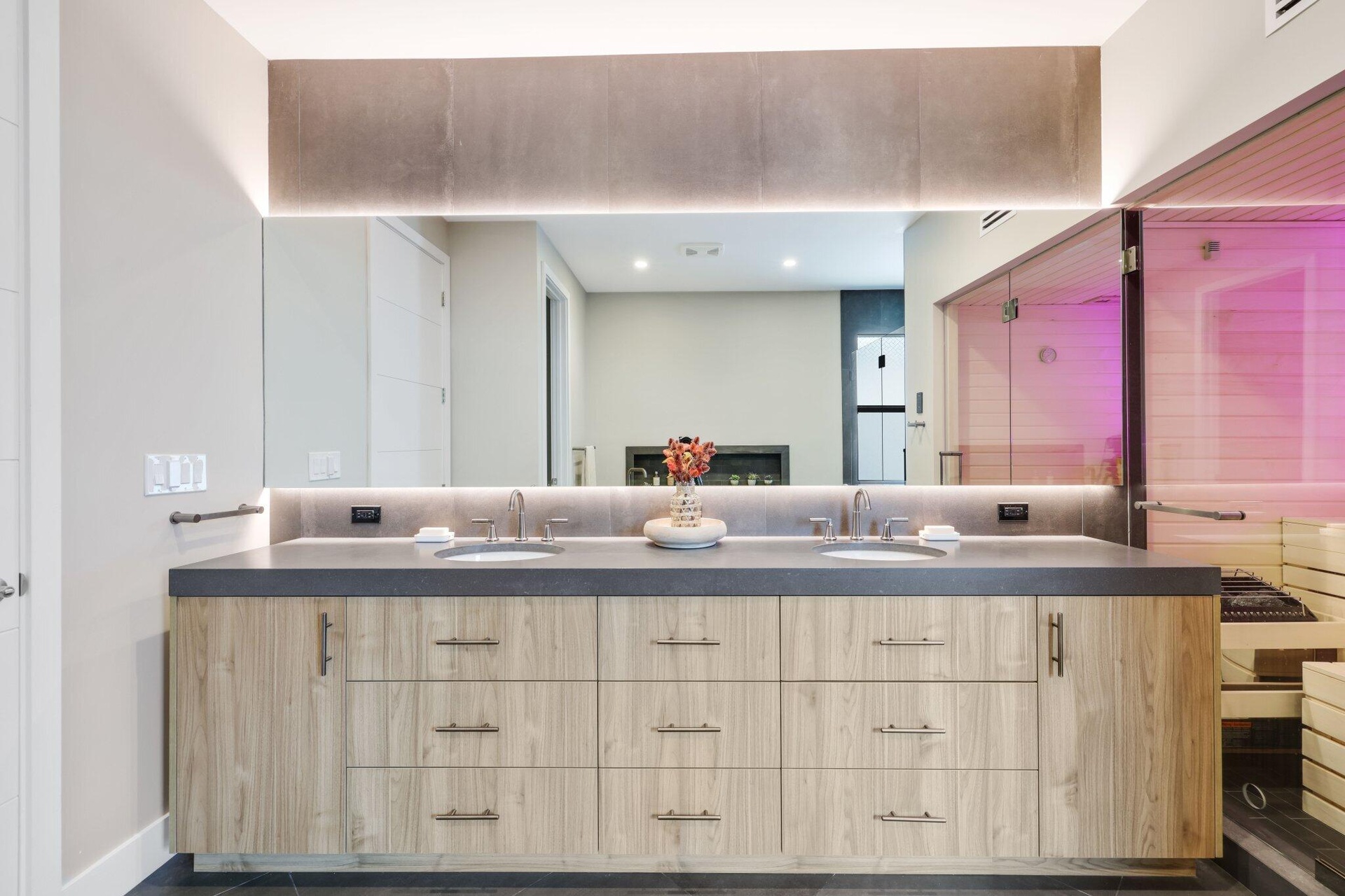 Cabinets with internal outlets and hidden ventilation slats on both ends of the cabinetry