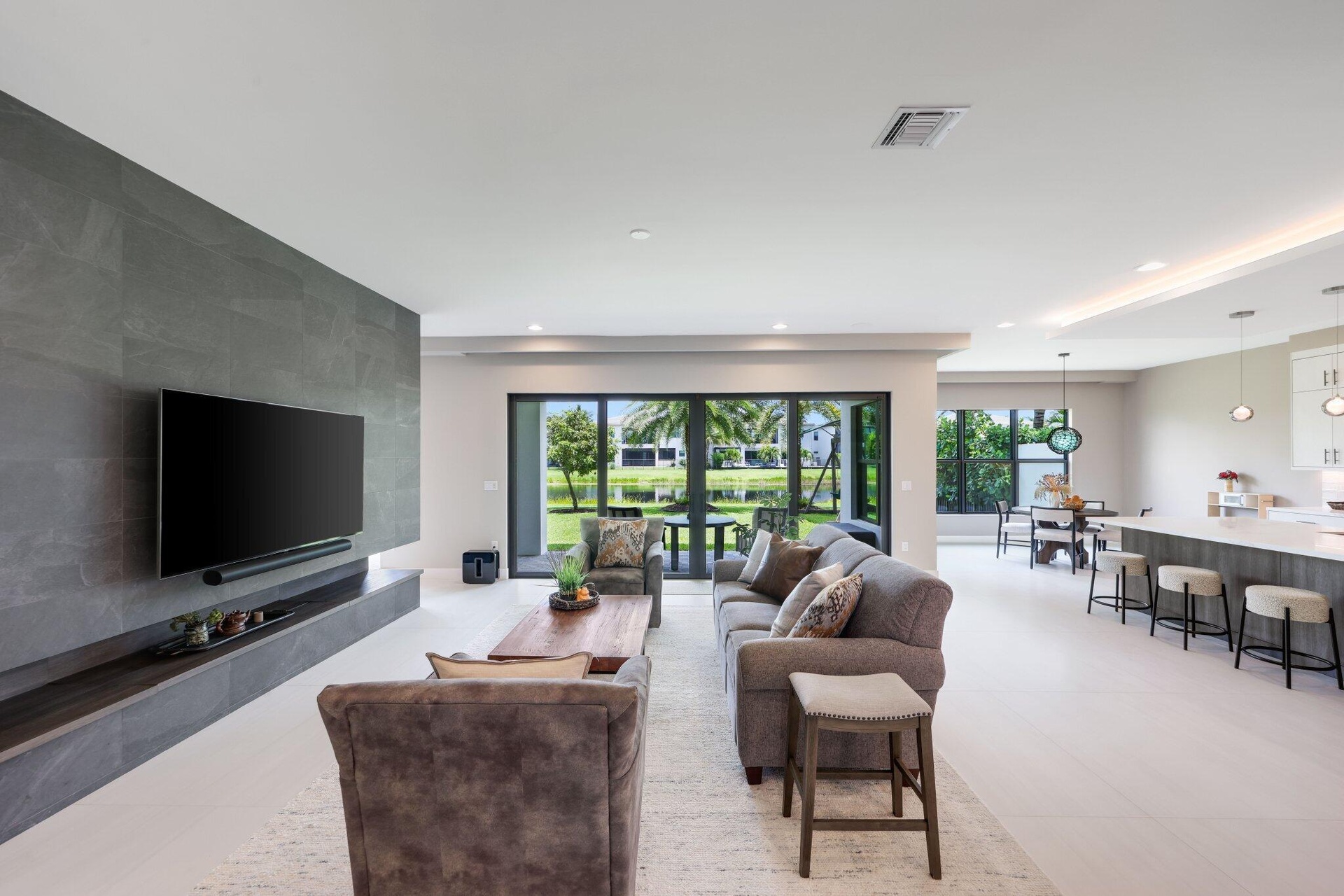 Living room w extended feature wall, tiled on both sides.