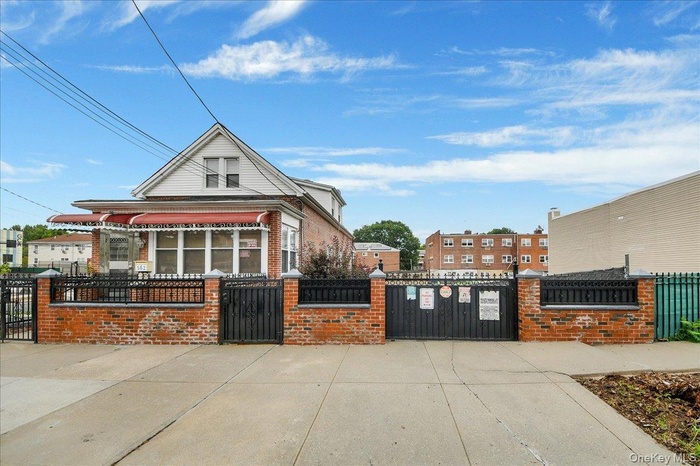 Fully fenced in two family on two lots in R5 zone!