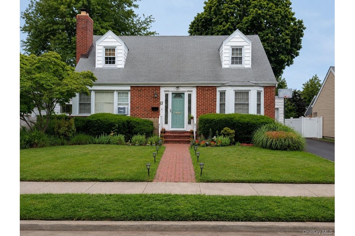Classic Cape Cod with tidy front yard