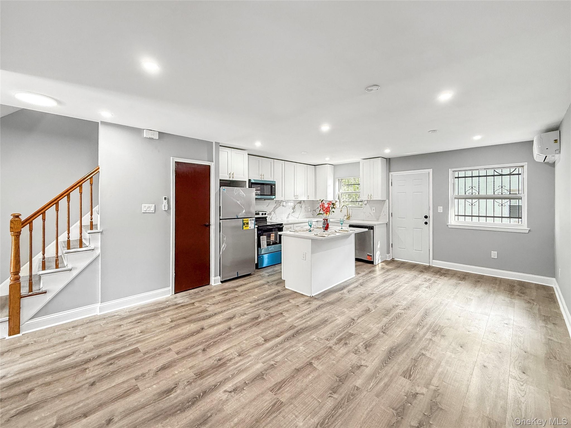 Unit 2 -Kitchen /Dining with exit to the deck and backyard