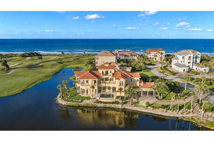 Located behind the exclusive North Gate of Hammock Dunes, this extraordinary Mediterranean estateoccupies one of the community’s most iconic peninsula