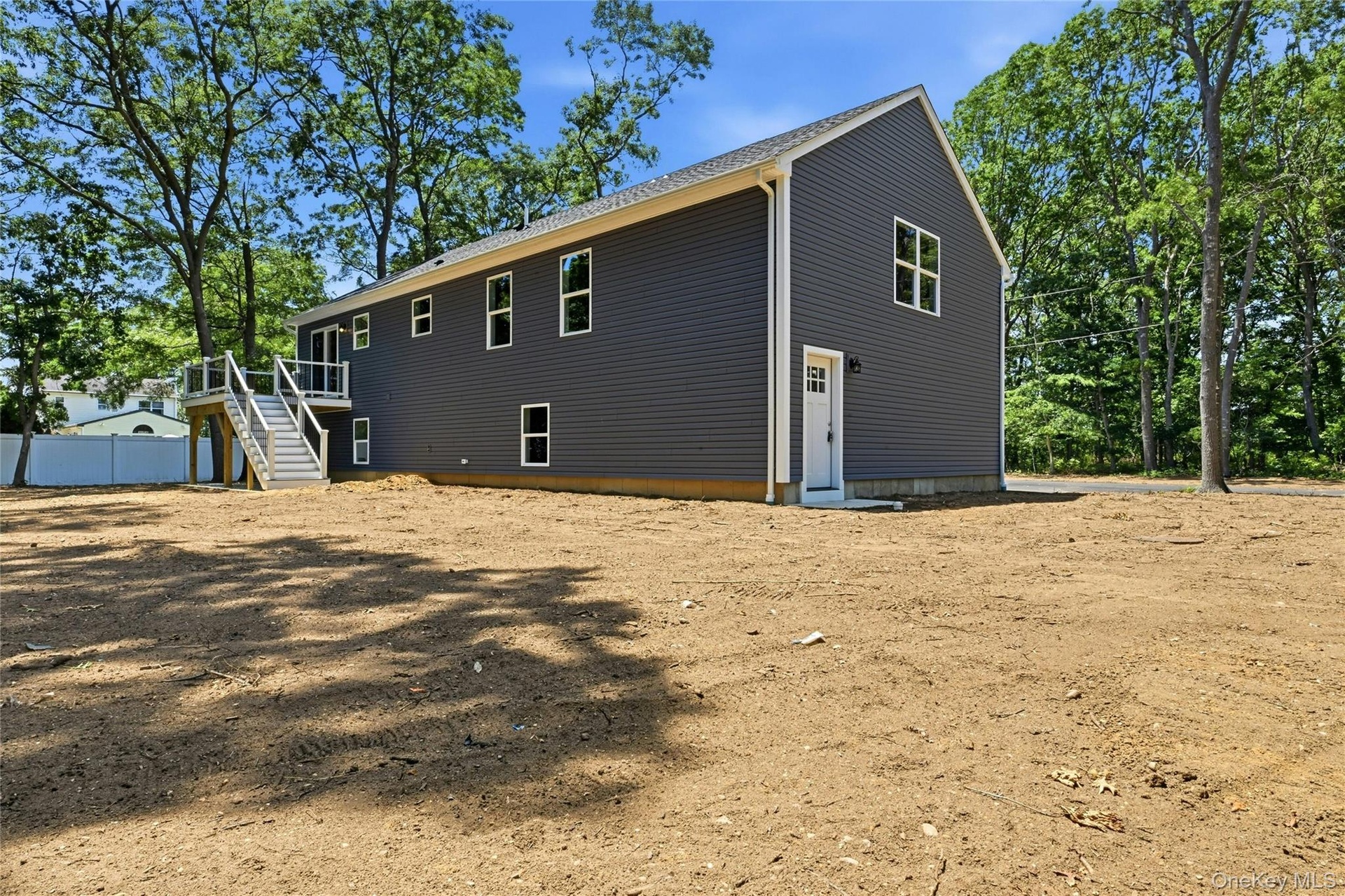 A private side entrance leads to a bright, finished lower level, offering flexible space that's ideal for quests, extended living, or future planning.