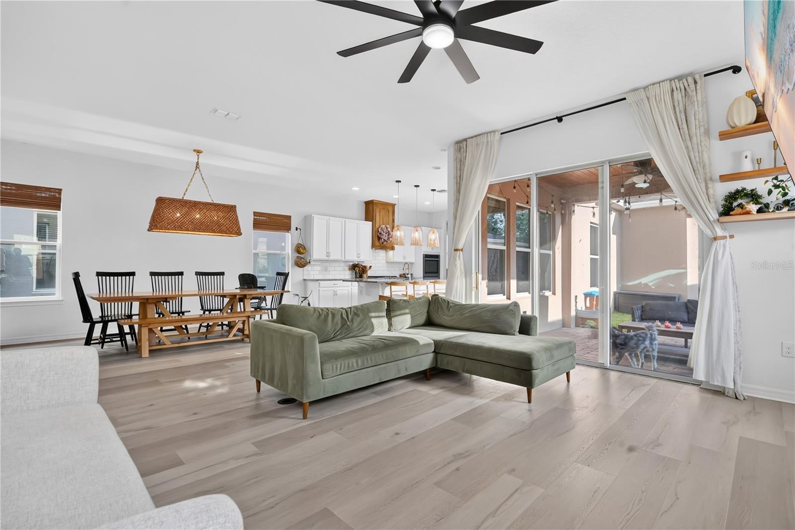 Living room, Kitchen and outdoor patio view