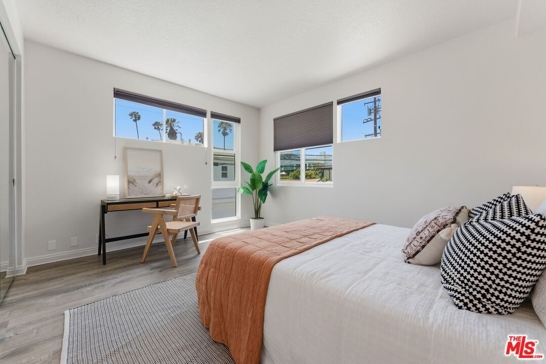 Bedroom featuring wood-style f