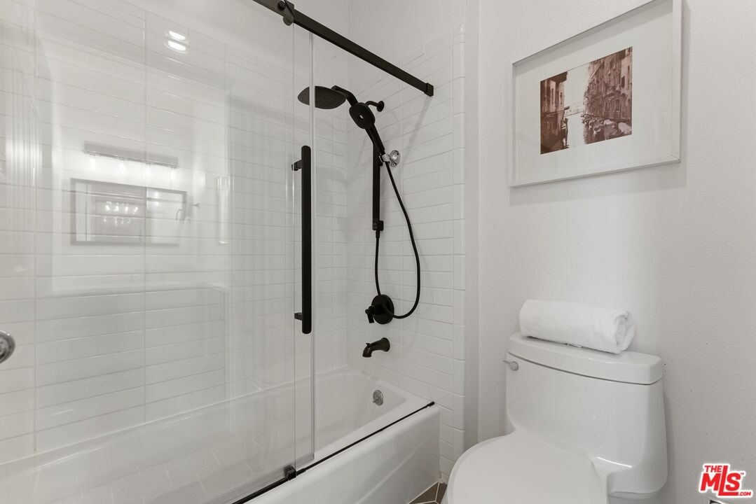 Bathroom featuring a shower-tu