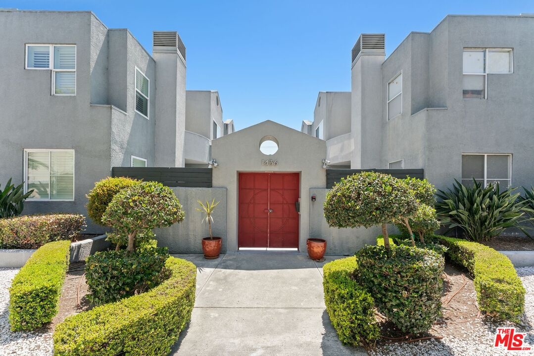Grey stucco multi-unit buildin