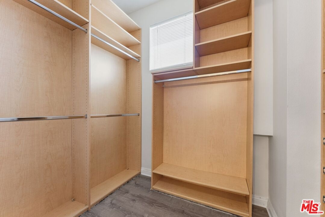 Walk-in closet featuring light