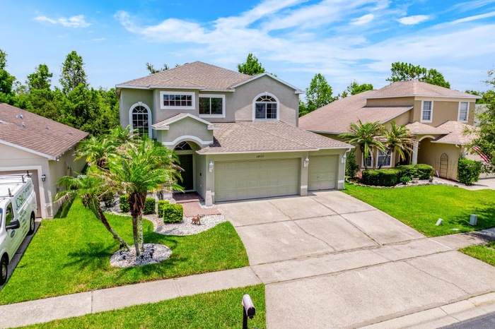 Situated on a premium FENCED ~ CONSERVATION LOT with peaceful WOODED VIEWS, this 3-bedroom, 2.5-bath residence offers modern finishes, multiple outdoo