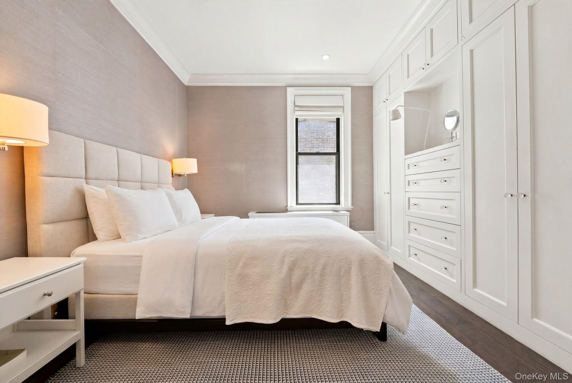 Expansive built-in custom cabinetry with recessed lighting and drawer storage