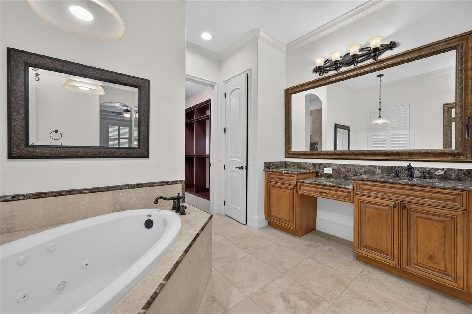 Primary Bathroom featuring dual vanities