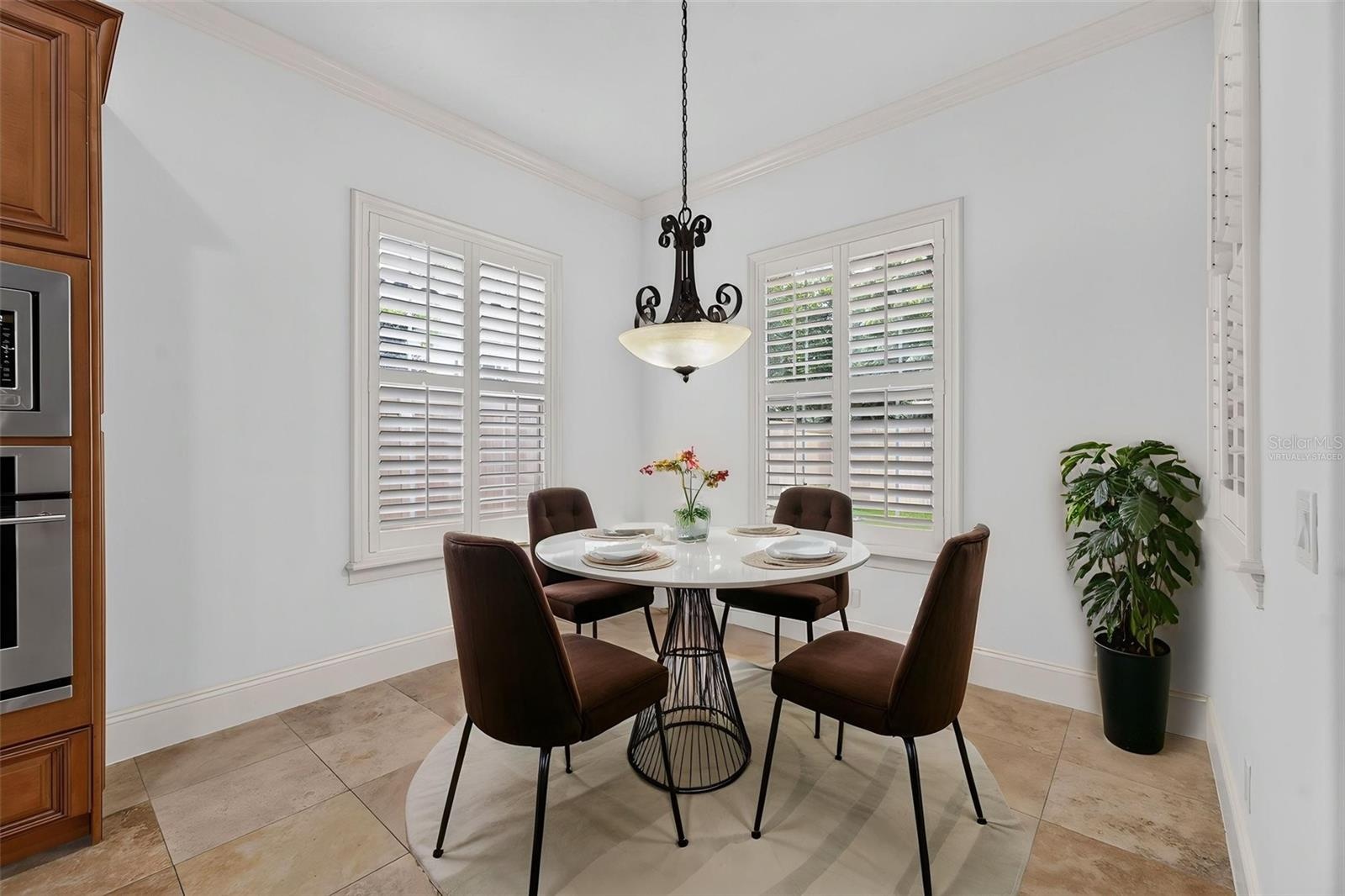 Virtually Staged. Cozy Breakfast Nook overlooking the backyard and pool area
