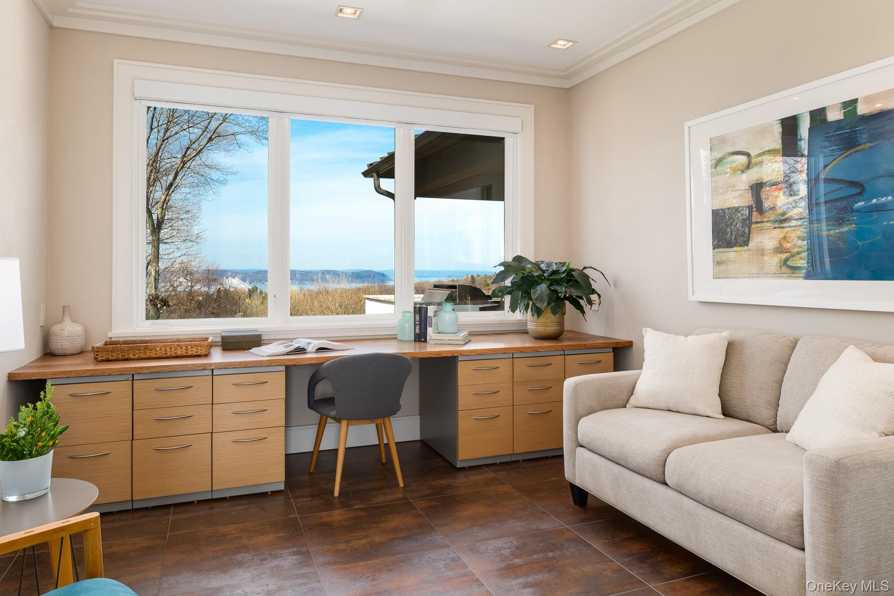 First floor guest bedroom with custom built-ins for home office.