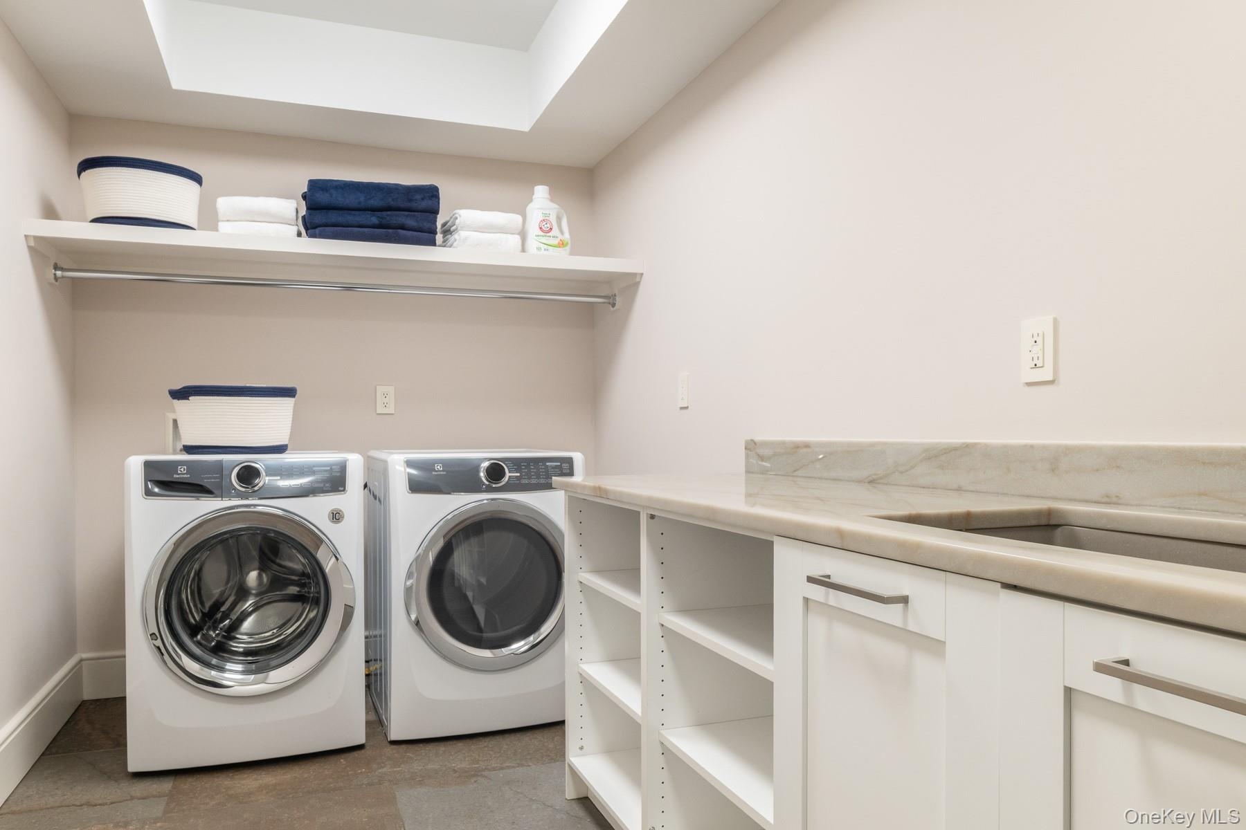 Spacious lower level laundry center.
