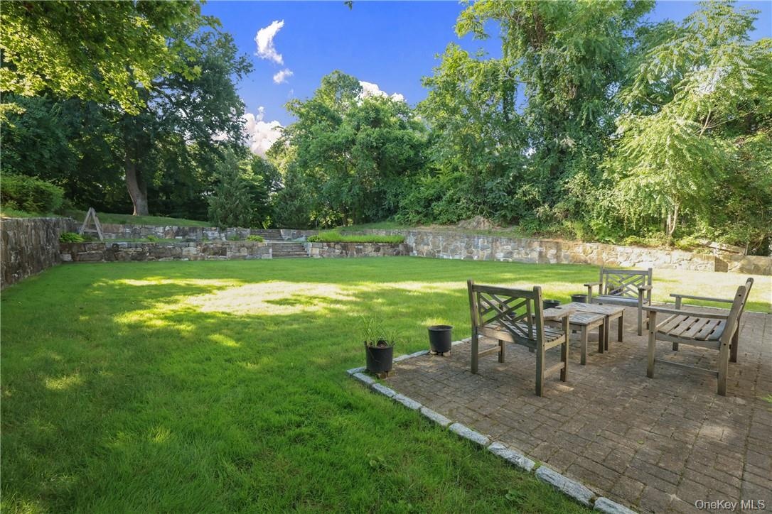 View of patio area and backyard