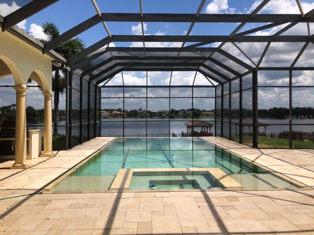 In-ground pool with screen enclosure