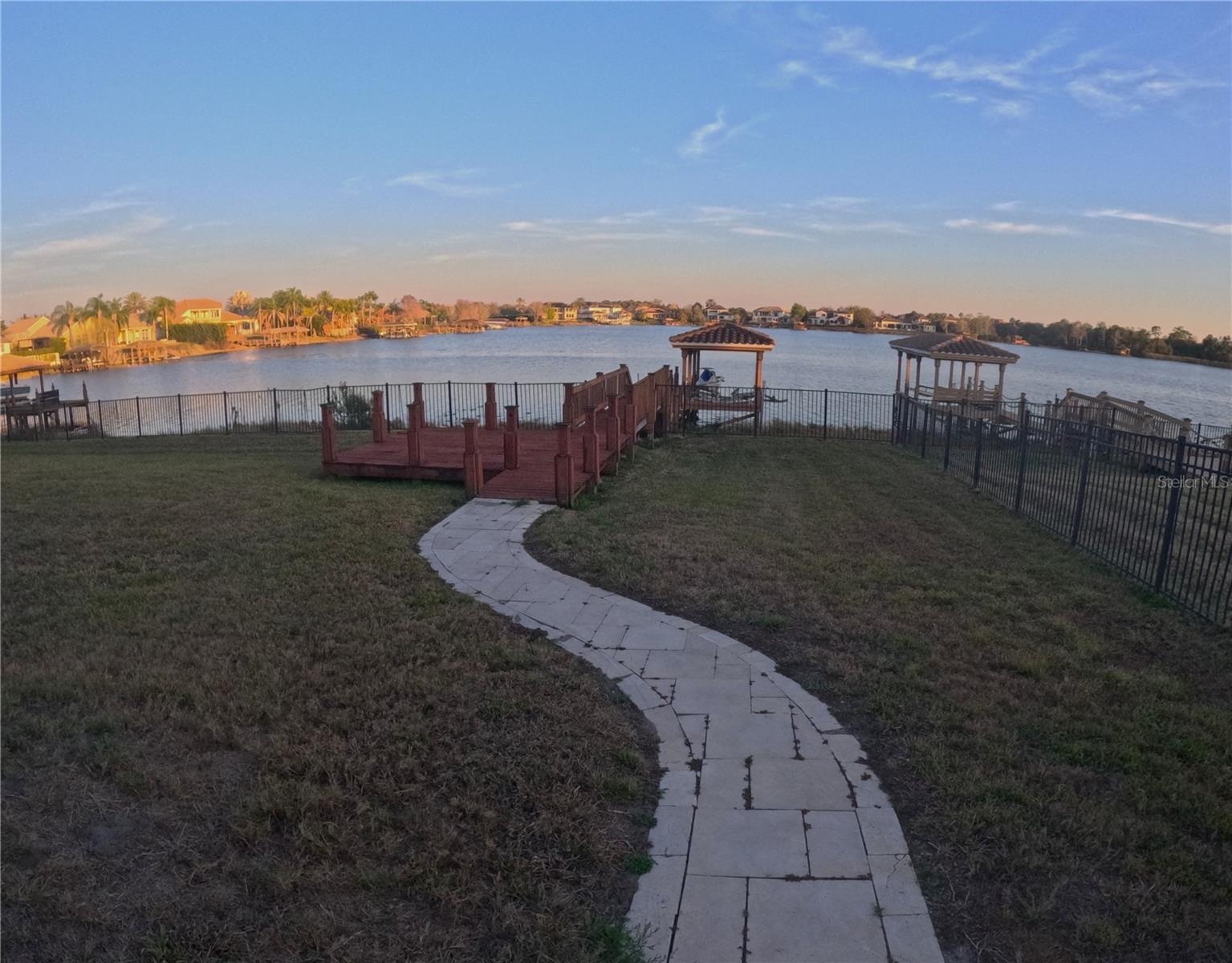 View of rear dock & lake-frontage at sunset