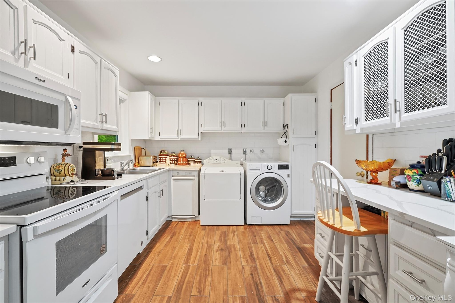 Kitchen with washer and dryer, which can be relocated to main lower level